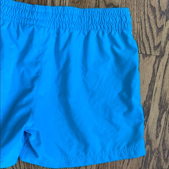 Bright turquoise with white side stripe Nike shorts with pockets, size women’s L - Picture 7 of 16